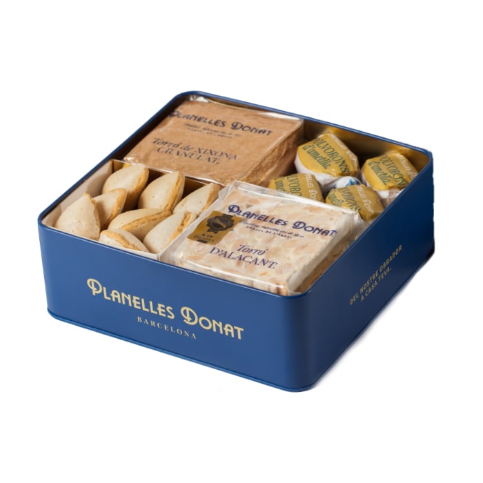 Boîte métallique avec 2 carrés de nougat et 2 carrés de confiseries